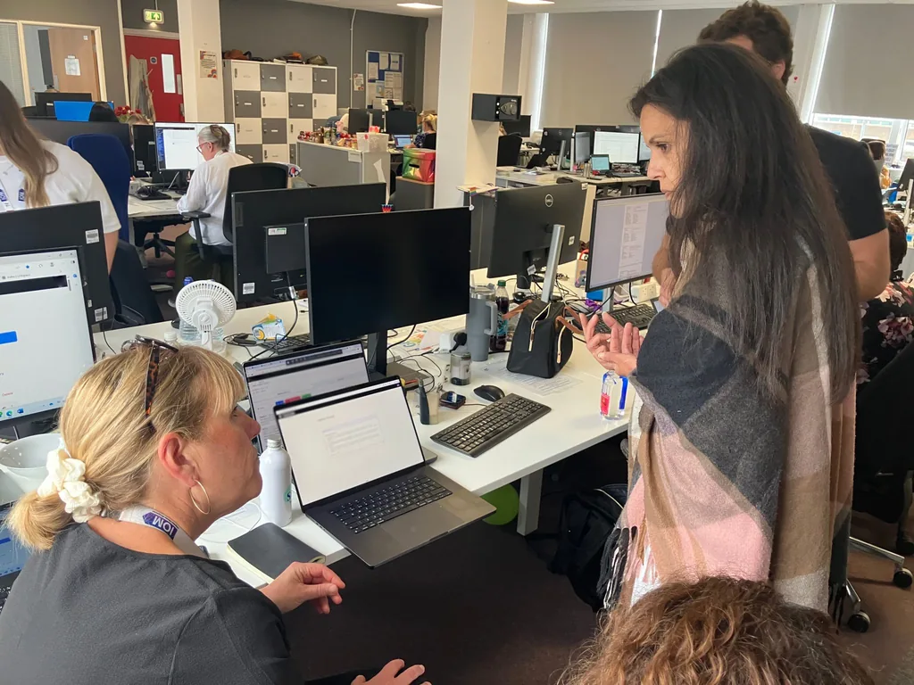 Forward Deployed Engineers working with probation officers in a probation office