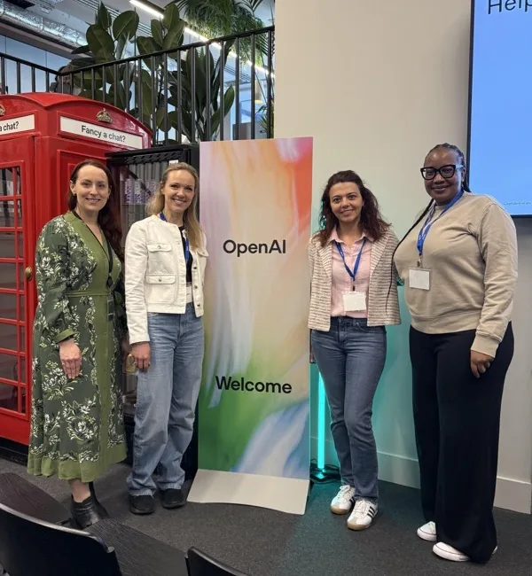 Network members at an OpenAI event